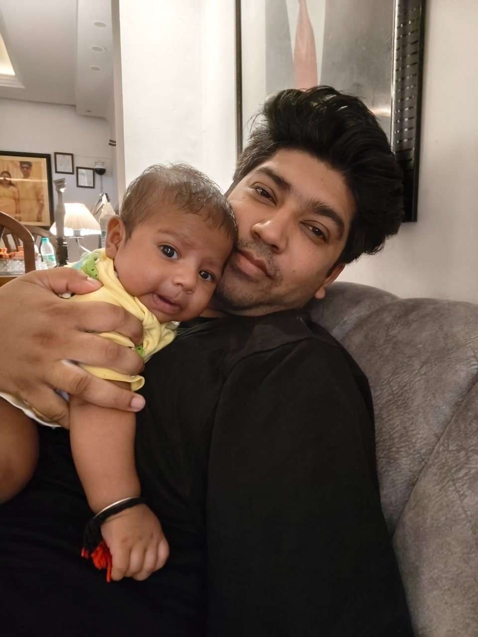 A father meeta his baby for the first time